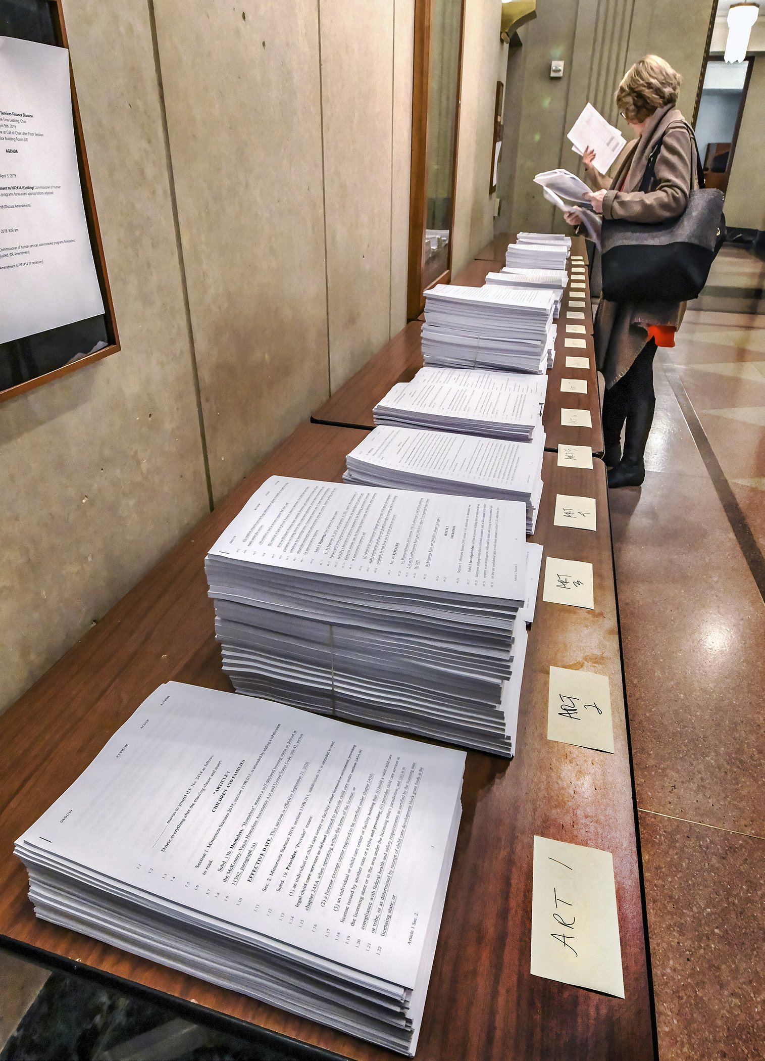 More than 80 amendments are spread out for distribution Friday morning as the House Health and Human Services Finance Division races to finish its omnibus bill. Photo by Andrew VonBank